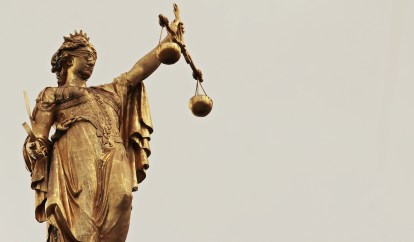 Lady Justice in gold legal writing.jpg